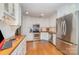 Bright kitchen with stainless steel appliances, butcher block countertops, and white cabinets at 10617 Fuller Ridge Cir, Charlotte, NC 28270
