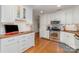 Bright kitchen with stainless steel appliances, butcher block countertops, and white cabinets at 10617 Fuller Ridge Cir, Charlotte, NC 28270