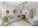 Inviting living room with a fireplace, decorative accents, and ample natural light at 10617 Fuller Ridge Cir, Charlotte, NC 28270