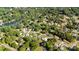 Overhead shot of a residential neighborhood with mature trees and a community pool near the lake at 113 Marina Ln, Mooresville, NC 28117