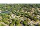 An aerial view of a neighborhood features tree-lined streets, well-maintained homes, and a tranquil lake at 113 Marina Ln, Mooresville, NC 28117
