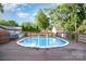 An inviting backyard features an above ground pool and a wooden deck for outdoor fun and relaxation at 113 Marina Ln, Mooresville, NC 28117