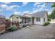 A well-maintained backyard featuring a sunroom, gravel area, and a wooden fence offers privacy and tranquility at 113 Marina Ln, Mooresville, NC 28117