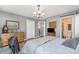 Spacious bedroom featuring a large bed, wood-look floors, and stylish decor at 113 Marina Ln, Mooresville, NC 28117