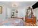 Charming bedroom featuring wood-look floors and a wooden dresser with a marble top at 113 Marina Ln, Mooresville, NC 28117