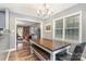 Bright dining area featuring a wooden table with bench seating and natural light at 113 Marina Ln, Mooresville, NC 28117