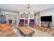 Inviting living area with hardwood floors, eclectic decor, and a cozy fireplace at 113 Marina Ln, Mooresville, NC 28117