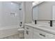 Bright bathroom boasts a double vanity with modern faucets, tile, and tub creating a functional and stylish space at 115 Falling Creek Dr, Statesville, NC 28625