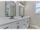 Elegant bathroom features double vanity with modern fixtures, framed mirrors, and ample counter space providing a spa-like feel at 115 Falling Creek Dr, Statesville, NC 28625