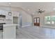 Open floor plan with views of the kitchen, ceiling fan, and exterior at 115 Falling Creek Dr, Statesville, NC 28625