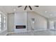 Bright living room boasts a fireplace, neutral walls, and views to the bathroom at 115 Falling Creek Dr, Statesville, NC 28625