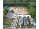 New construction homes in The Courts of Prince Charles surrounded by mature trees, and construction underway at 1223 Royal Prince Ct, Charlotte, NC 28226