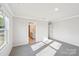 Spacious bedroom with carpet, crown molding, and an ensuite bathroom at 125 Canoga Ave, York, SC 29745