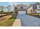 Charming two-story home with brick and siding exterior, a well-kept lawn, and attached garage at 125 Canoga Ave, York, SC 29745