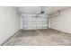 Clean garage with concrete floor and white walls at 125 Canoga Ave, York, SC 29745