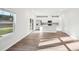 Open-concept living room and kitchen area with light wood floors and ample natural light at 125 Canoga Ave, York, SC 29745
