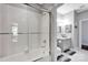 Bright bathroom with a tiled shower/tub combination and neutral color palette at 127 N Tryon St # 404, Charlotte, NC 28202