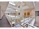 Well-lit hallway featuring multiple levels and contemporary railings, enhancing a bright and modern living space at 127 N Tryon St # 404, Charlotte, NC 28202