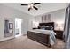 Spacious main bedroom featuring a plush bed, side tables, and a glimpse into a well-appointed en-suite bathroom at 127 N Tryon St # 404, Charlotte, NC 28202