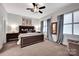 A cozy primary bedroom with soft lighting, a plush bed, and calming decor for ultimate relaxation at 127 N Tryon St # 404, Charlotte, NC 28202