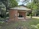 Side exterior showing a covered back porch with trash bins at 13134 Homewood Dr, Charlotte, NC 28262