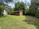 Spacious backyard featuring a well-maintained lawn, mature trees, and an inviting outdoor space at 13134 Homewood Dr, Charlotte, NC 28262