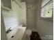 Bathroom featuring a standing shower, toilet and sink at 13134 Homewood Dr, Charlotte, NC 28262