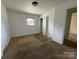 Bedroom featuring carpet flooring, a window, and closet access at 13134 Homewood Dr, Charlotte, NC 28262