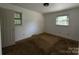 Standard bedroom featuring neutral walls, carpeted floors, and natural light from two windows at 13134 Homewood Dr, Charlotte, NC 28262