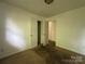 Bedroom with carpet flooring and views to other rooms in the house at 13134 Homewood Dr, Charlotte, NC 28262