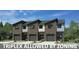 Modern triplex featuring sleek architectural lines, private garages, and contemporary finishes at 13134 Homewood Dr, Charlotte, NC 28262