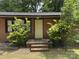 Charming brick home featuring a welcoming front entrance with a well-maintained landscape at 13134 Homewood Dr, Charlotte, NC 28262