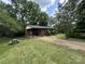 Quaint home featuring a well-manicured front lawn and a cozy covered porch at 13134 Homewood Dr, Charlotte, NC 28262