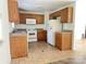 Functional kitchen with wooden cabinets, white appliances, and ample counter space at 13134 Homewood Dr, Charlotte, NC 28262