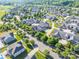 Aerial view of a residential area showcasing well-maintained homes with mature trees and green spaces at 1328 Somersby Cir, Gastonia, NC 28054