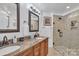 Bathroom featuring double vanity with granite countertops and a walk-in shower at 1328 Somersby Cir, Gastonia, NC 28054