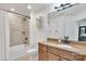This bathroom features a shower-tub combination and a vanity with a granite countertop at 1328 Somersby Cir, Gastonia, NC 28054