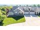 Charming home showcasing stone accents, three-car garage, and a well-manicured front lawn at 1328 Somersby Cir, Gastonia, NC 28054