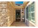 Inviting front entrance featuring a stone facade, brick walkway, and a stylish glass door at 1328 Somersby Cir, Gastonia, NC 28054