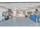 Well-organized garage features epoxy flooring, overhead lighting, and ample storage with mounted tool organizers at 1328 Somersby Cir, Gastonia, NC 28054
