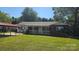 Charming brick home with a covered porch and carport, nestled on a lush lawn at 133 Pine State Rd, Troutman, NC 28166