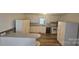 Bright kitchen features ample counter space, white cabinetry, and modern appliances on wood-look floors at 133 Pine State Rd, Troutman, NC 28166