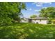Expansive backyard with lush green grass and mature trees, providing a serene outdoor space at 1417 W Monroe St, Salisbury, NC 28144