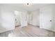 Bright bedroom with wood-look floors, neutral paint, and access to an ensuite bathroom at 1417 W Monroe St, Salisbury, NC 28144