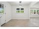Bright dining area featuring wood-look floors, a stylish light fixture, and ample natural light at 1417 W Monroe St, Salisbury, NC 28144