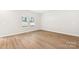 Bright bedroom with wood flooring and two windows overlooking the outdoors at 1421 Wildflower St, Newton, NC 28658
