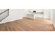 Open-concept living room with hardwood floors and access to the kitchen and staircase at 1421 Wildflower St, Newton, NC 28658