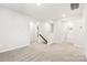 Spacious loft area with plush carpeting and access to several bedrooms and bathrooms at 1421 Wildflower St, Newton, NC 28658