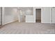 Inviting carpeted loft area with neutral walls, offering a versatile space for relaxation or entertainment at 145 Satchel Ct, Mooresville, NC 28115