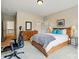 Inviting bedroom with hardwood furniture, soft carpet, and large windows, offering a functional and comfortable space at 15714 Laurel Oak Cres, Davidson, NC 28036
